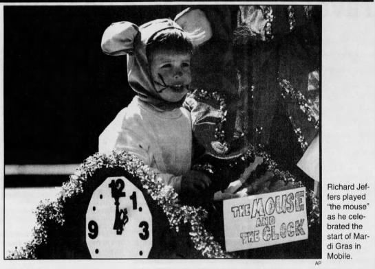 Richard plays "the mouse" as he celebrated Mardi Gras
